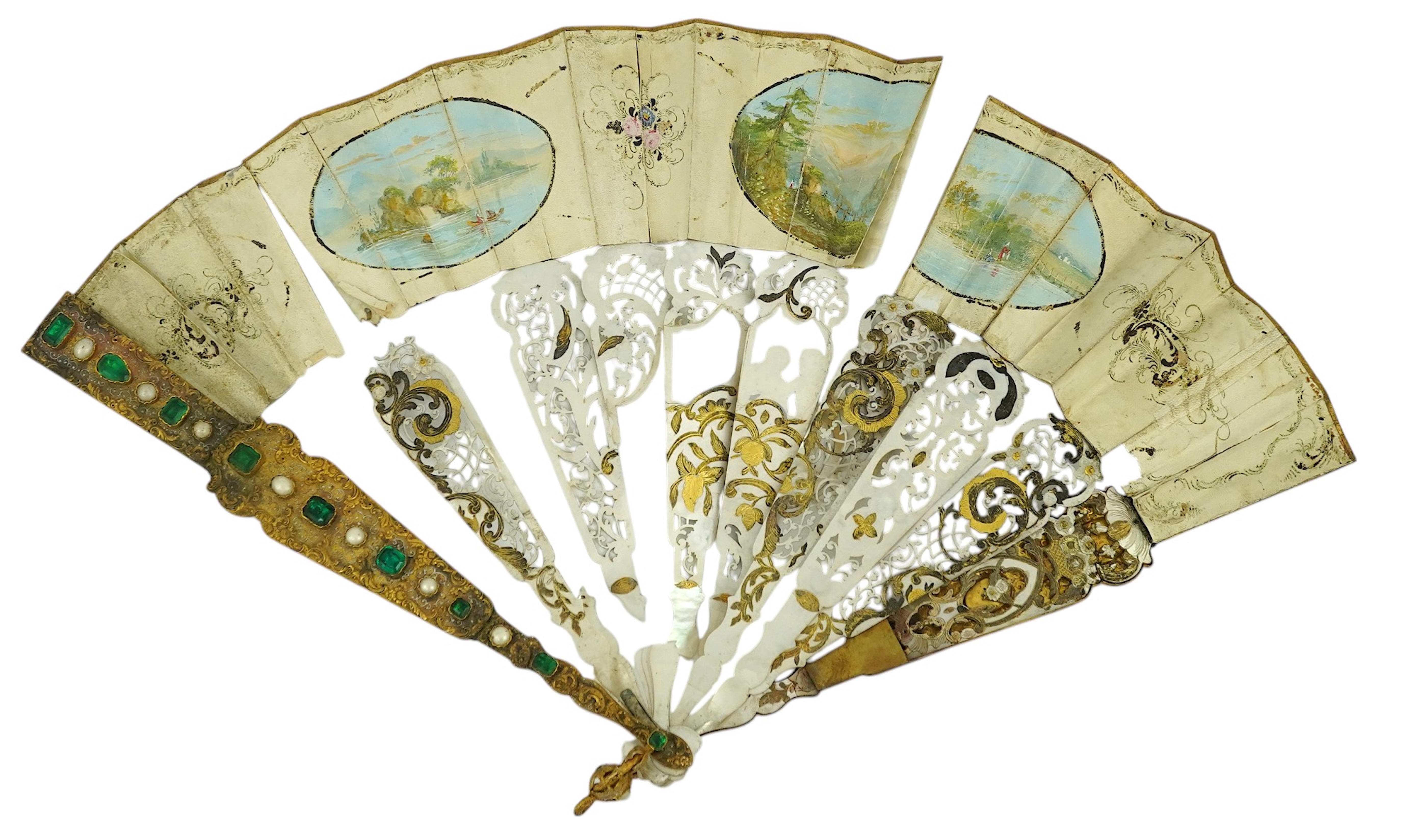 Two giltwood fans and display cases, one on a pedestal base housing an 18th century French figural hand painted fan with bone and gilt decorated guards and sticks, the other set with paste gilt metal guards on mother of